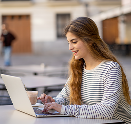 girl studying on laptop