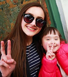 Female student poses with a woman