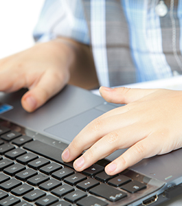 Students fingers on a keyboard